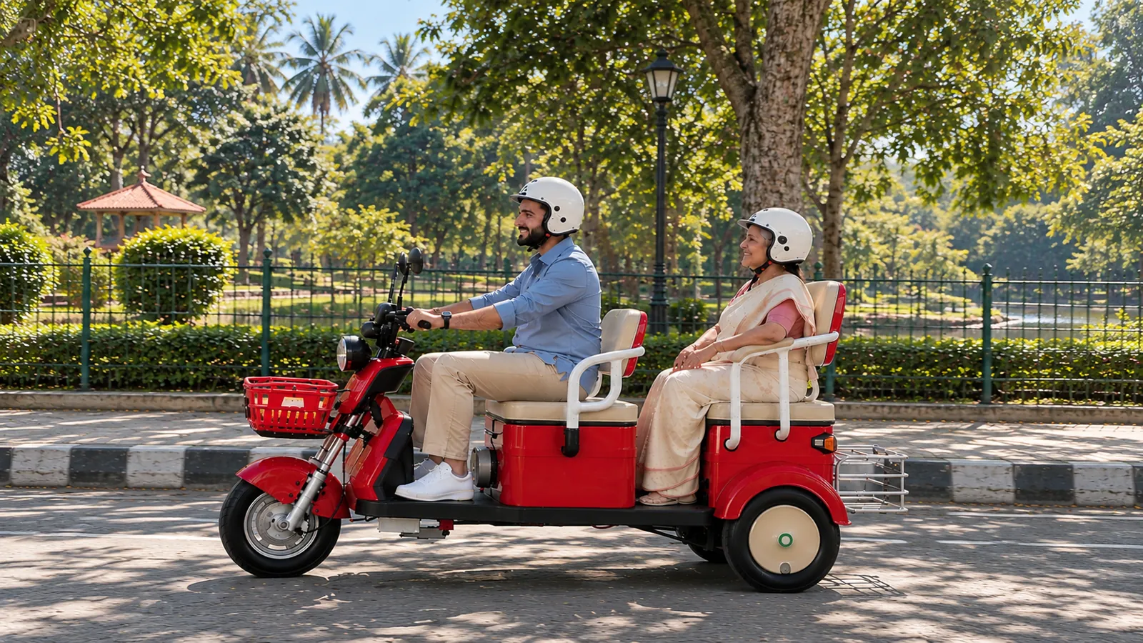 A son riding the NJA-7 along a shaded park road with his mother on the rear seat
